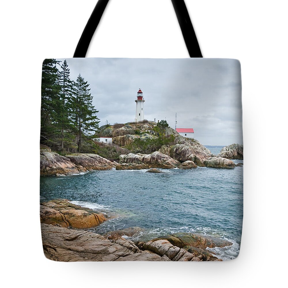 Architecture Tote Bag featuring the photograph Point Atkinson Lighthouse and Rocky Shore by Jeff Goulden