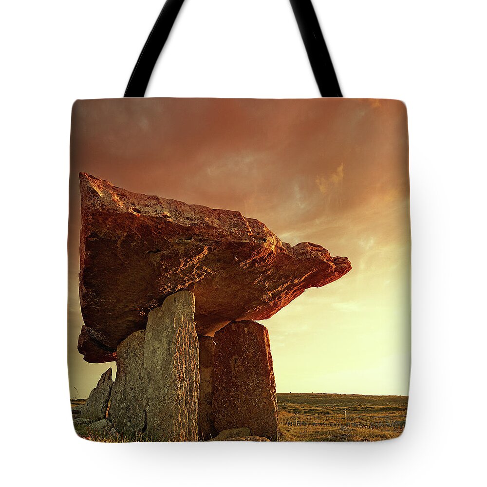 Prehistoric Era Tote Bag featuring the photograph Poulnabrone Dolmen At Sunset by Mammuth