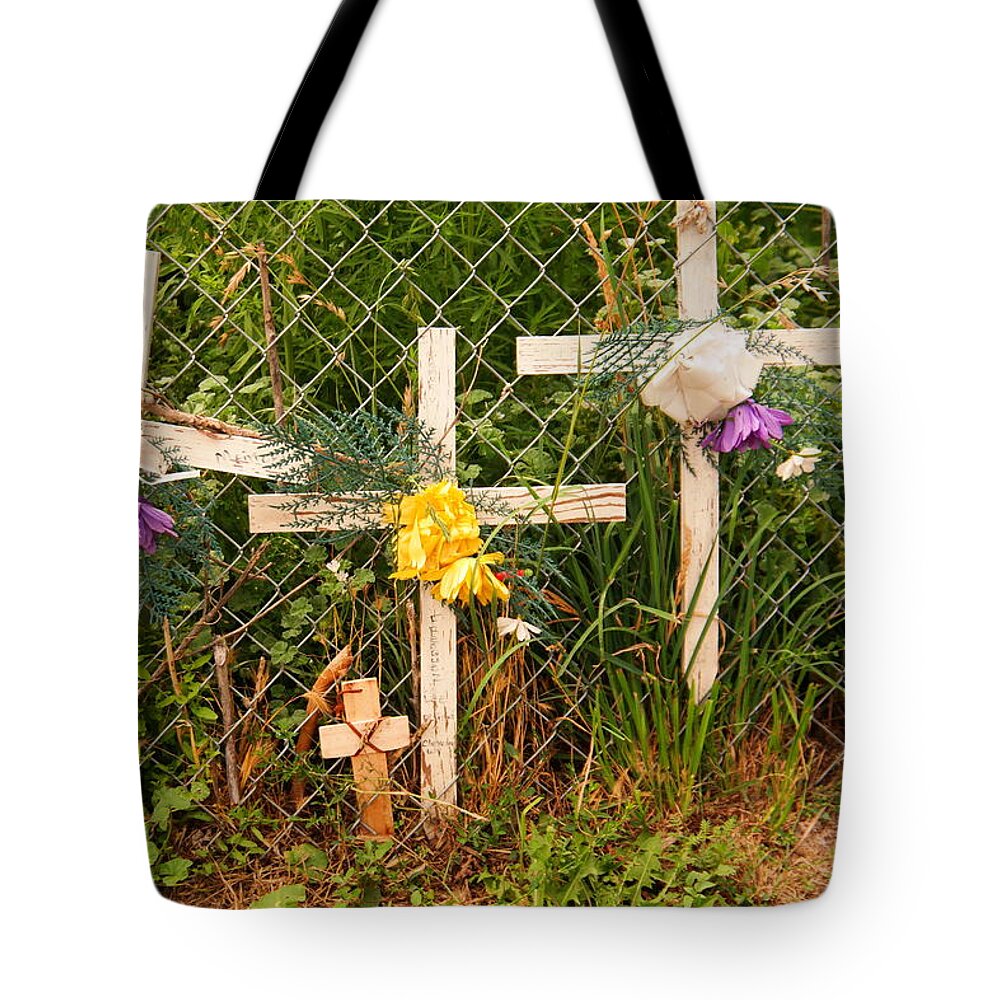Crosses Tote Bag featuring the photograph Prayers On The Fence by Jeff Swan
