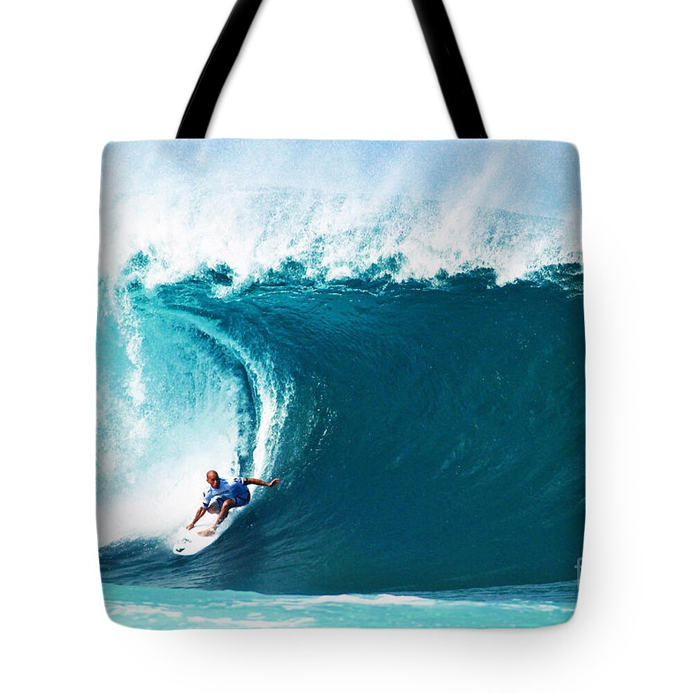 Kelly Slater Tote Bag featuring the photograph Pro Surfer Kelly Slater Surfing in the Pipeline Masters Contest by Paul Topp