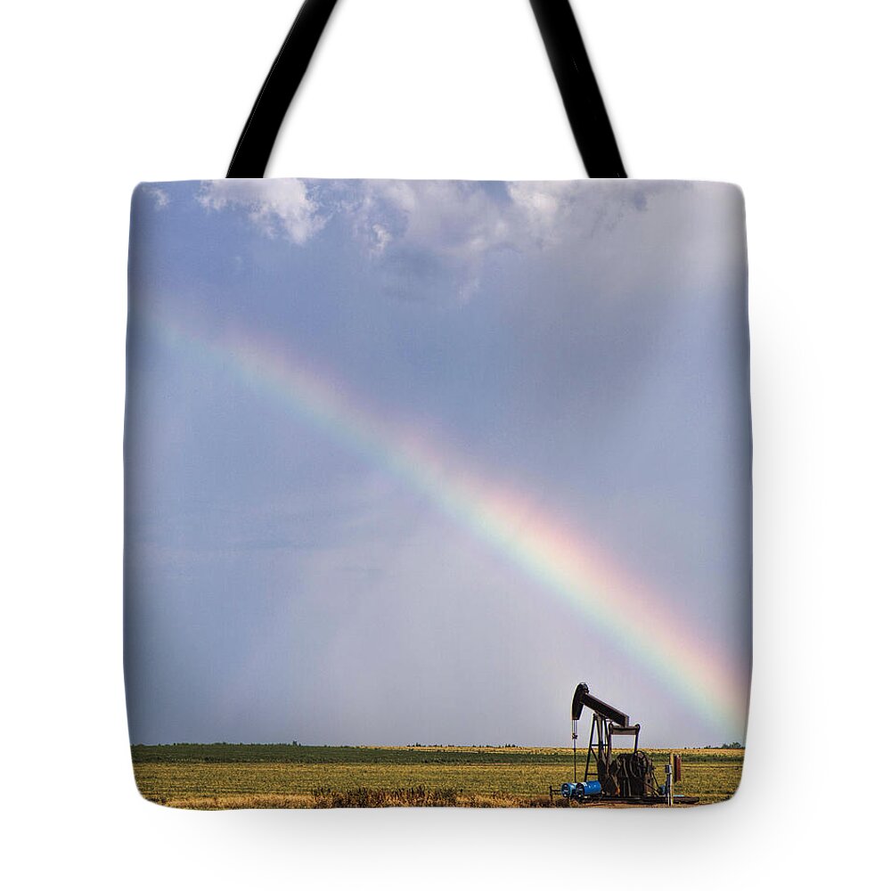 Kansas Tote Bag featuring the photograph Rainbow and oil pump by Rob Graham