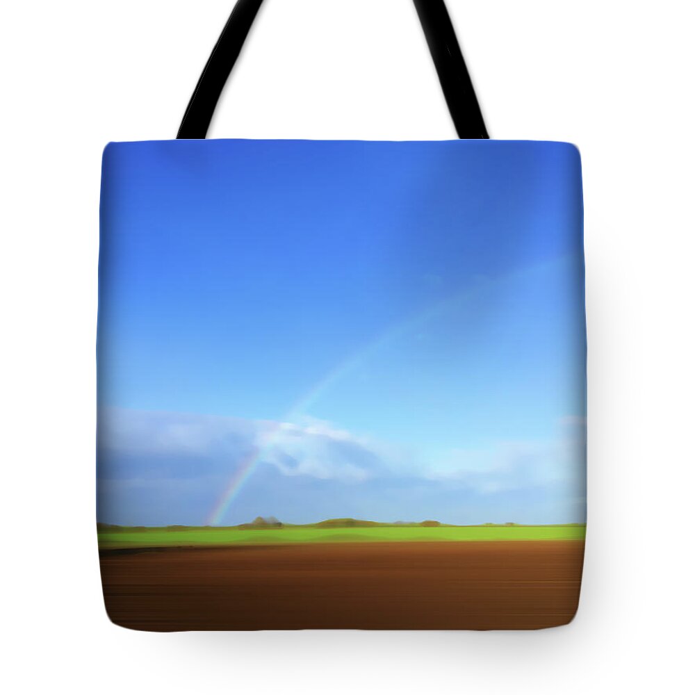 Beauty In Nature Tote Bag featuring the photograph Rainbow In Field by Ikon Ikon Images