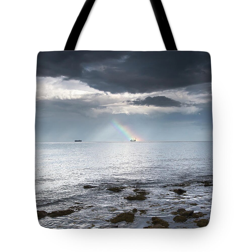 England Tote Bag featuring the photograph Rainbow In The Distance As Seen Off The by John Short / Design Pics