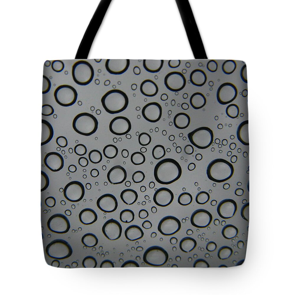 Raindrops Tote Bag featuring the photograph Raindrops by Bill Tomsa