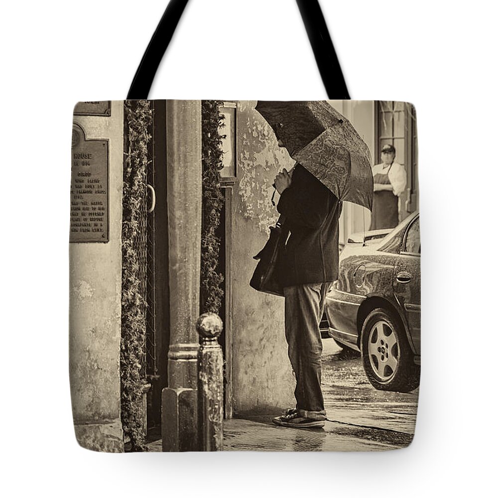 Umbrella Tote Bag featuring the photograph Rainy Day Menu Reading - Monochrome by Kathleen K Parker