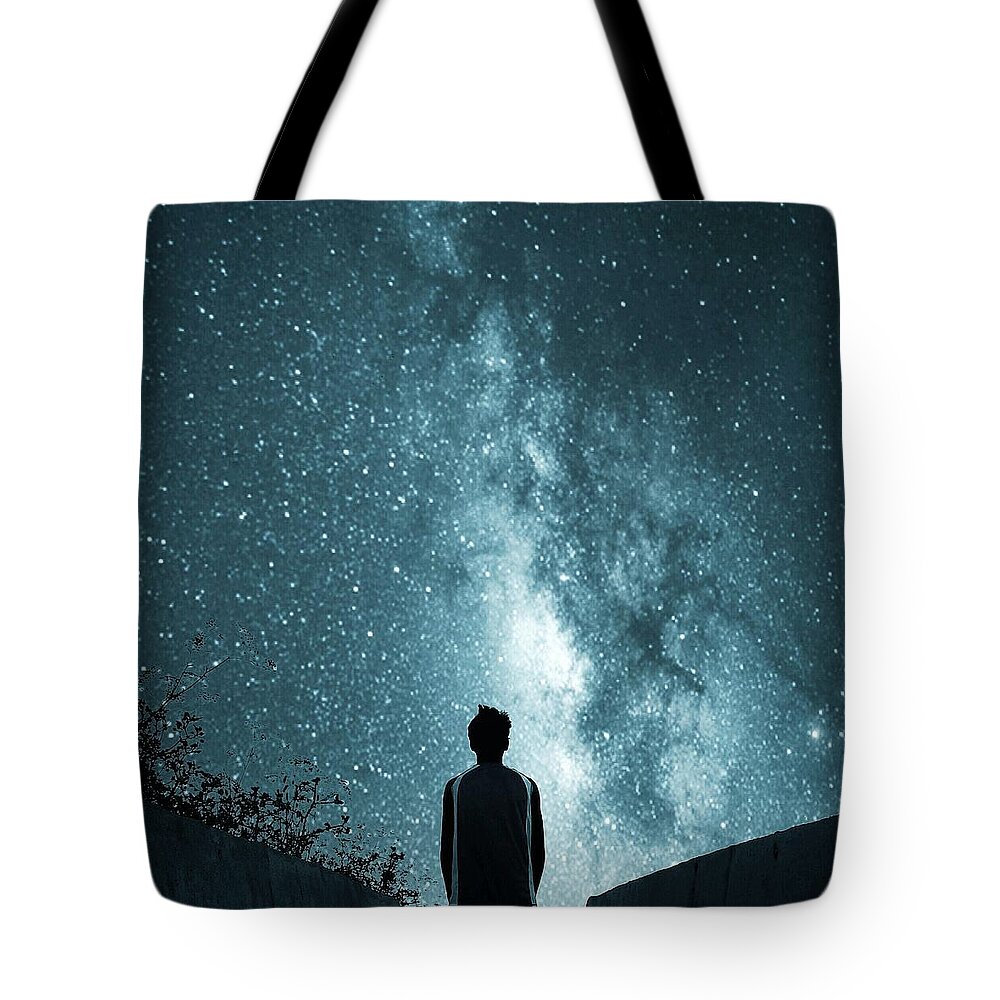 Tranquility Tote Bag featuring the photograph Rear View Of Man Looking At Star Field by Cal Ag / Eyeem