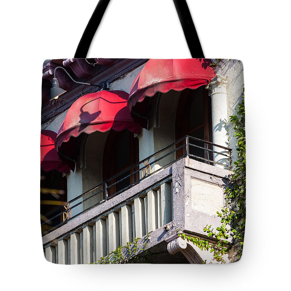 1924 Tote Bag featuring the photograph Red Awnings at the Van Dyke by Ed Gleichman