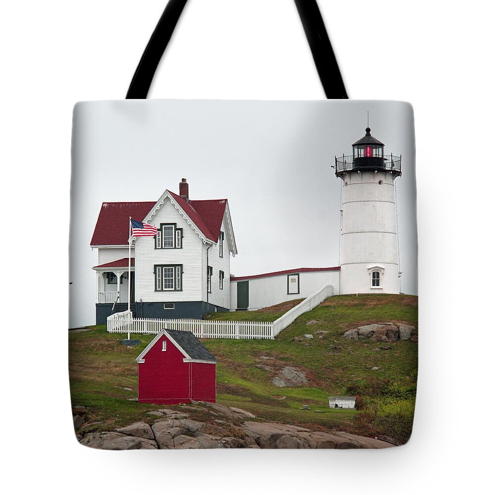 Lighthouse Tote Bag featuring the photograph Red Beacon on Nubble Light by Barbara McDevitt