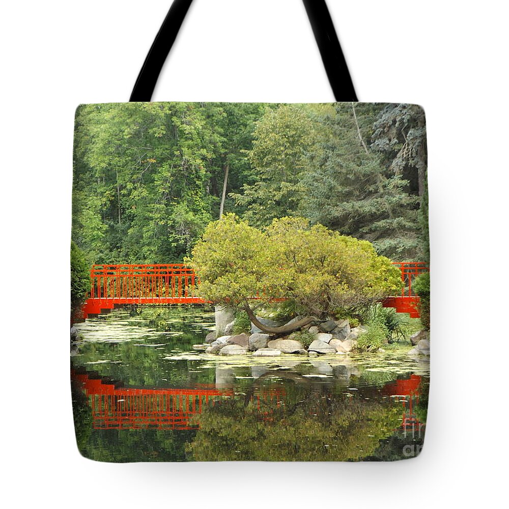 Red Tote Bag featuring the photograph Red Bridge Reflection in a Pond by Erick Schmidt