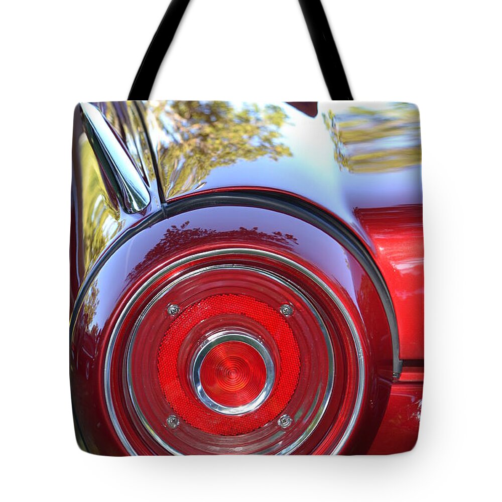 Red Tote Bag featuring the photograph Red Ford Tailight by Dean Ferreira