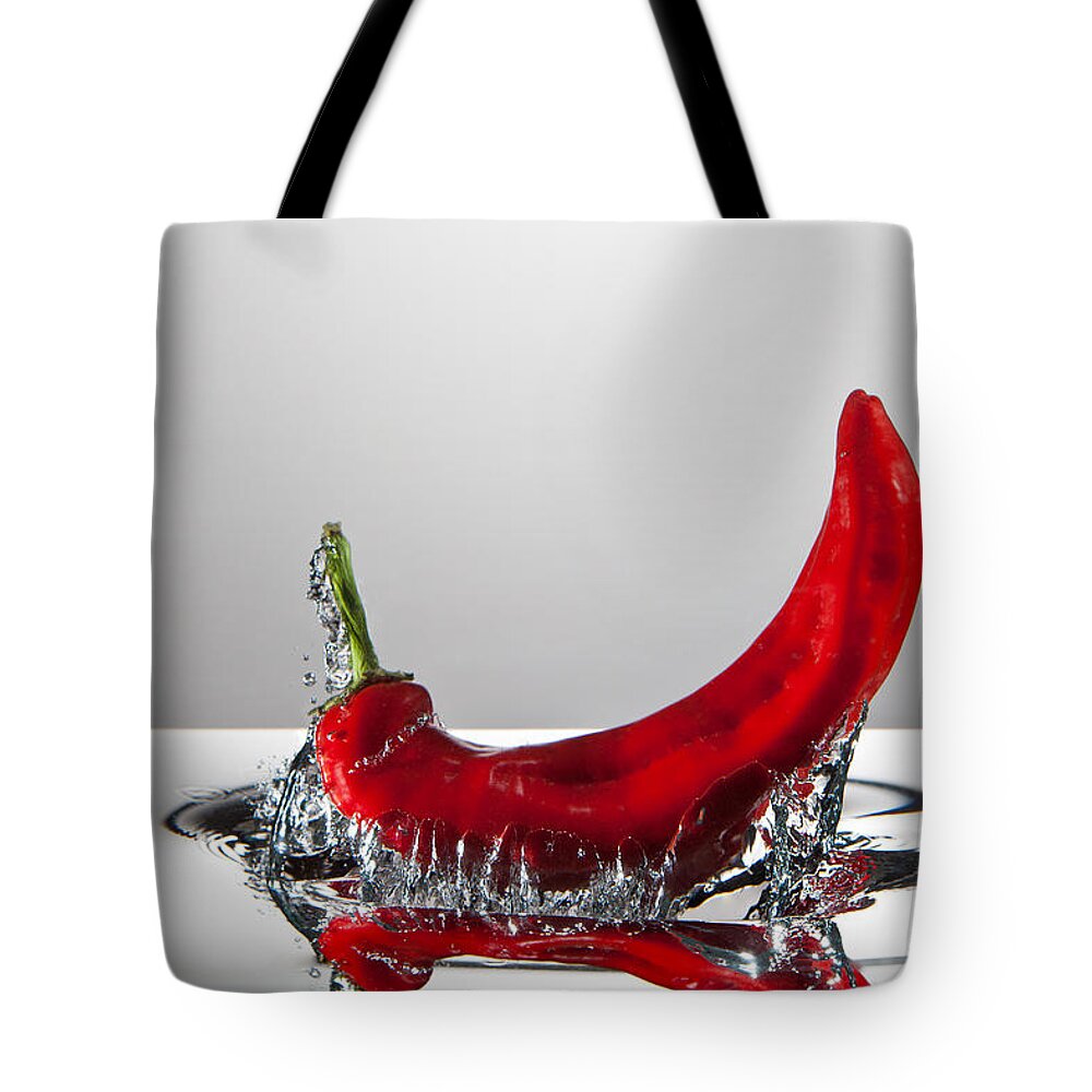 Red Tote Bag featuring the photograph Red Pepper FreshSplash by Steve Gadomski