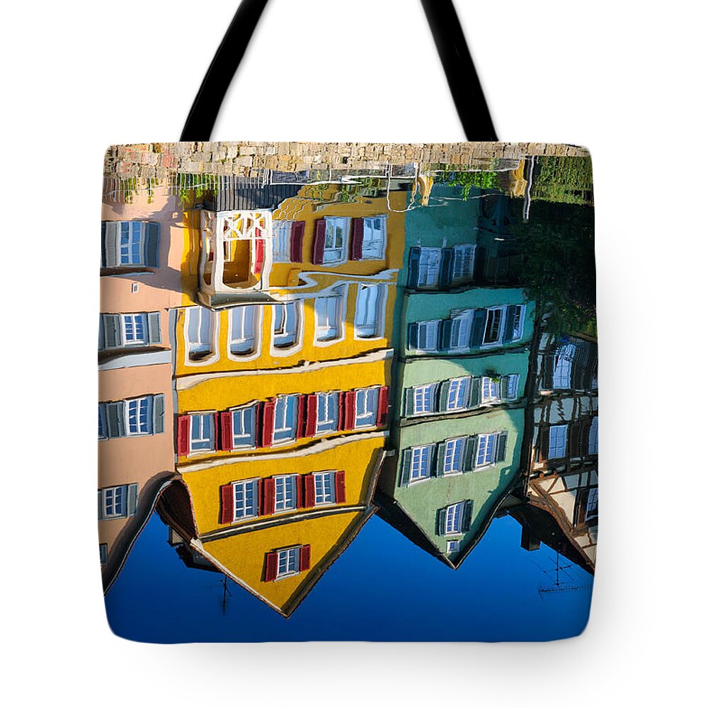 Reflection Tote Bag featuring the photograph Reflection of colorful houses in Neckar river Tuebingen Germany by Matthias Hauser