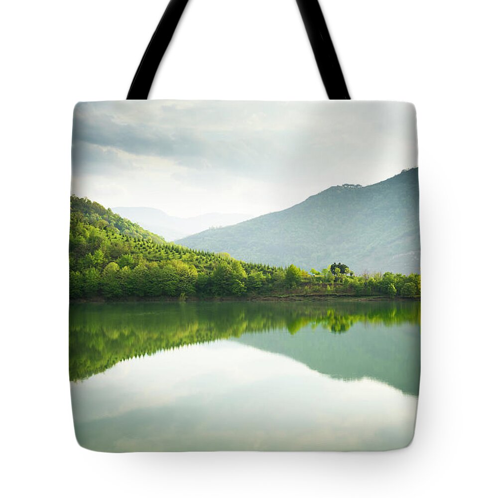 Water's Edge Tote Bag featuring the photograph Reflections On A Lake by Adempercem