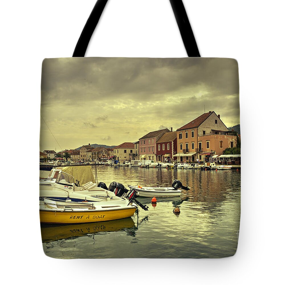 Stari Grad Tote Bag featuring the photograph rent A boat by Rob Hawkins