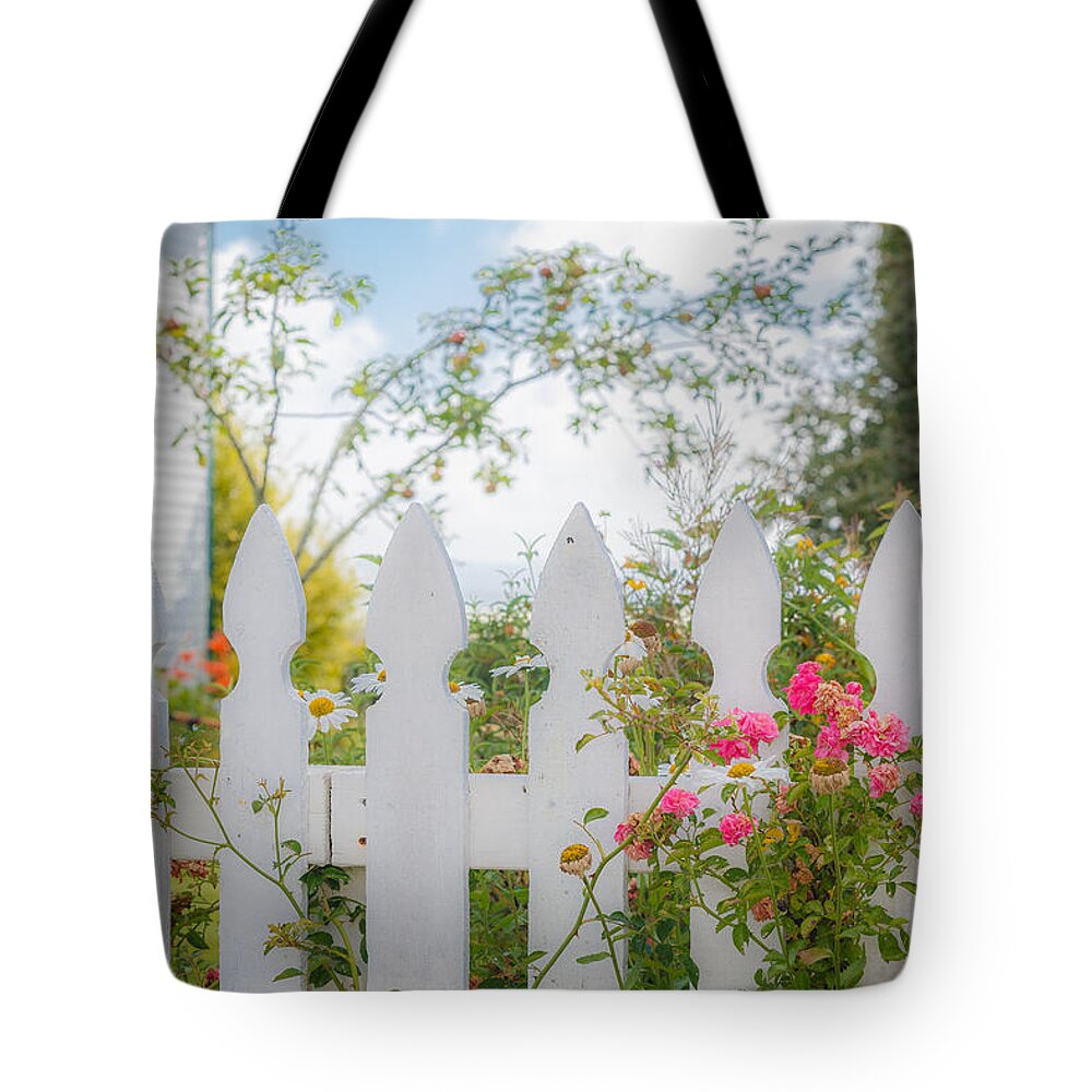 Picket Fence Tote Bag featuring the photograph Roses on a Fence by Mike Penney
