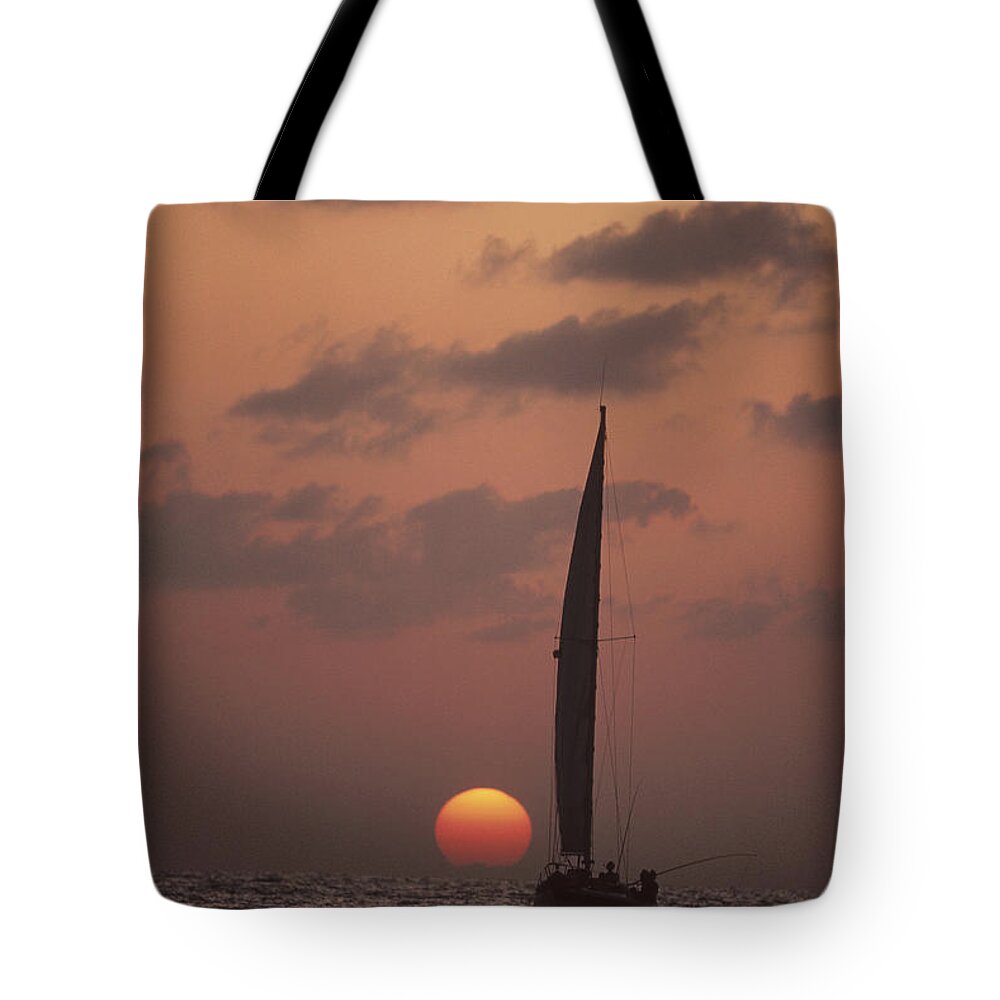 Feb0514 Tote Bag featuring the photograph Sailboat Adrift At Sunset Sri Lanka by Flip Nicklin