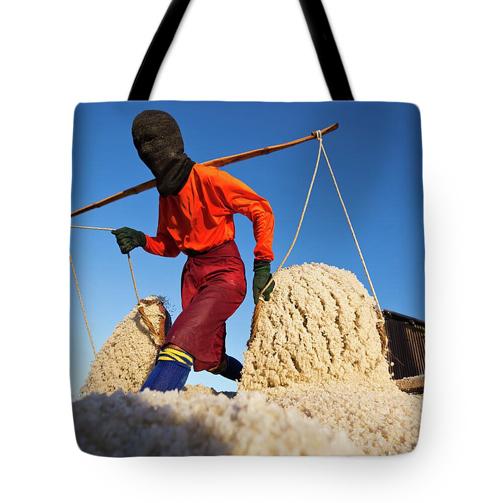 Expertise Tote Bag featuring the photograph Salt Farm Worker, Thailand by Monthon Wa