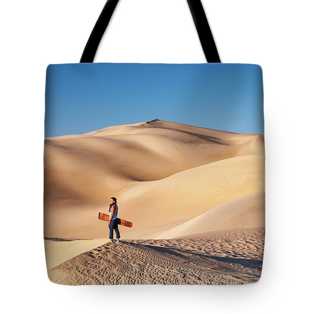 Scenics Tote Bag featuring the photograph Sandboarding In The Sahara Desert by Hadynyah