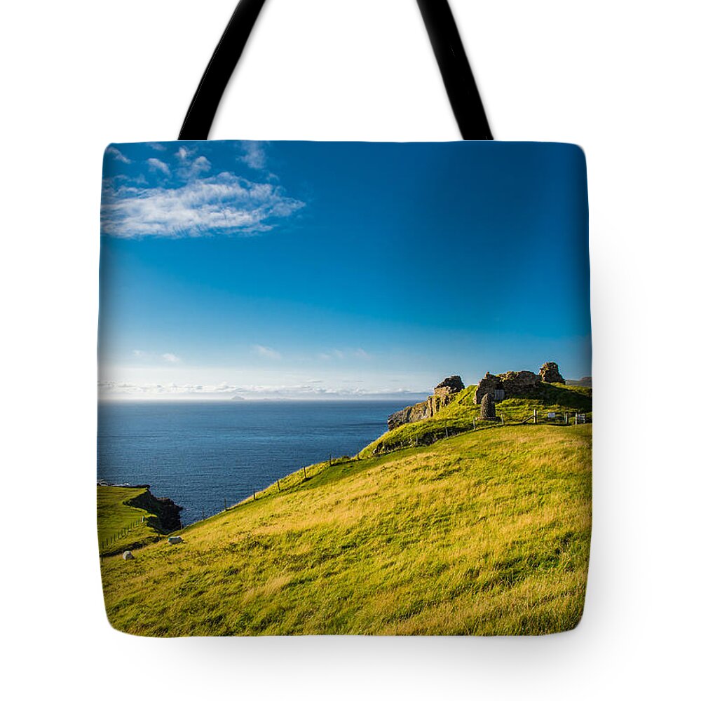 Scotland Tote Bag featuring the photograph Scottish Coast With Castle Ruin by Andreas Berthold