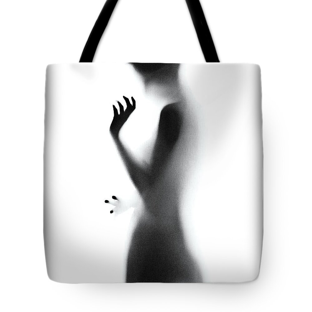 Shadow Tote Bag featuring the photograph Shadow by Azemdega