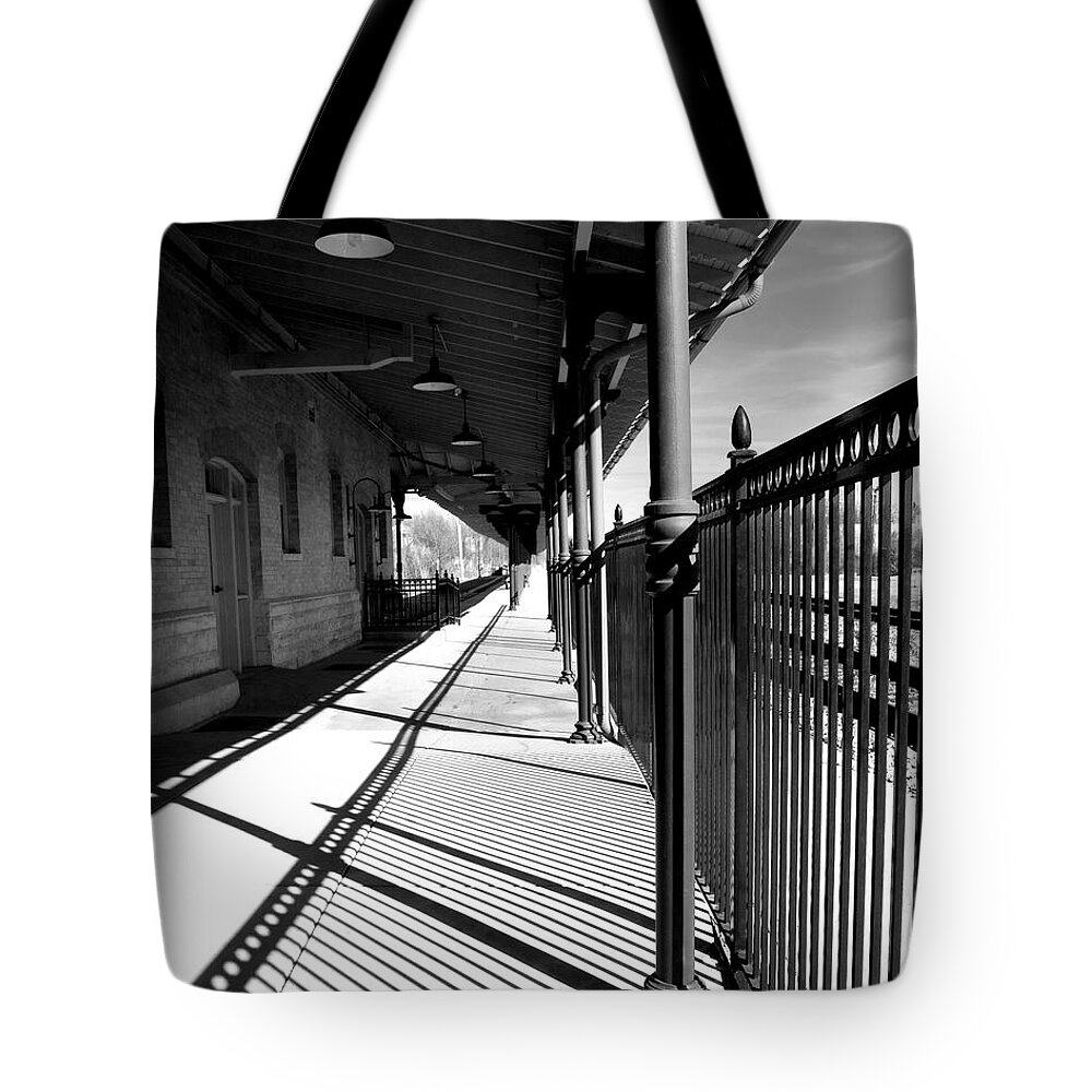 Bristol Tote Bag featuring the photograph Shadows at the station by Denise Beverly