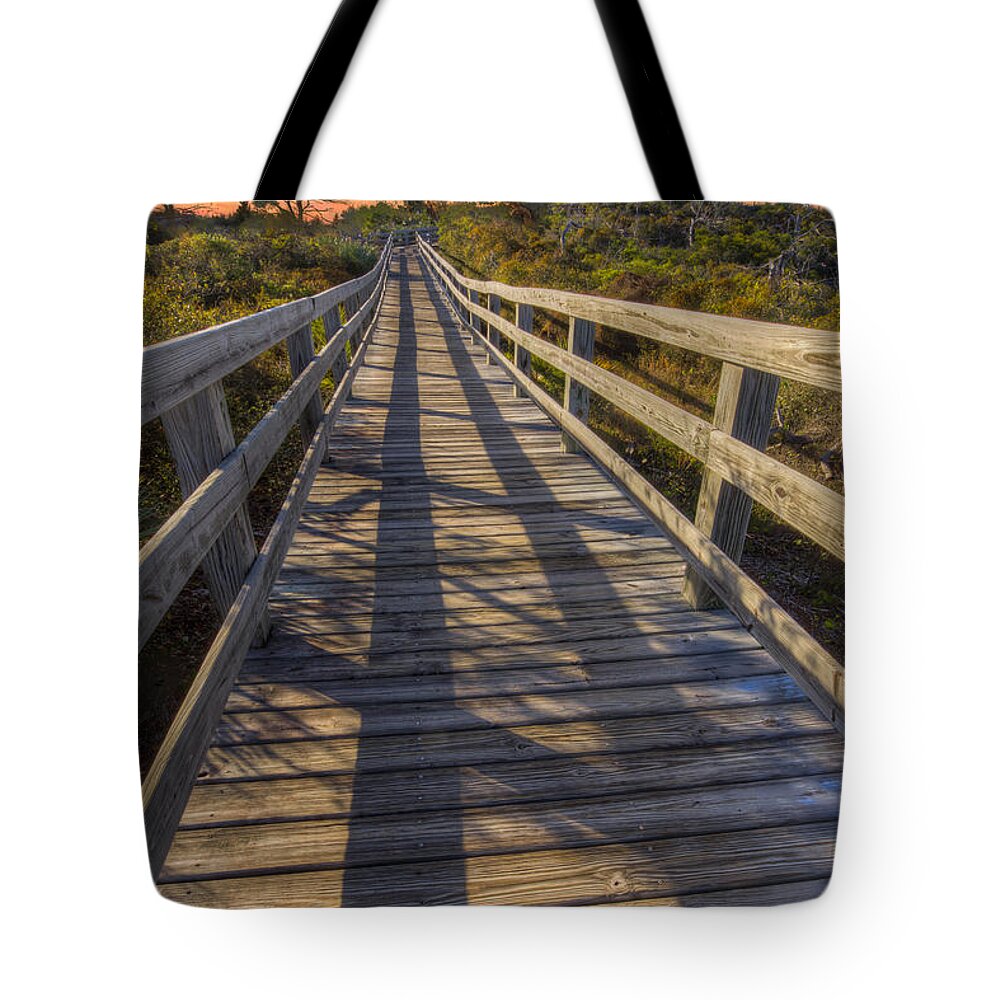 Clouds Tote Bag featuring the photograph Shadows on the Boardwalk by Debra and Dave Vanderlaan