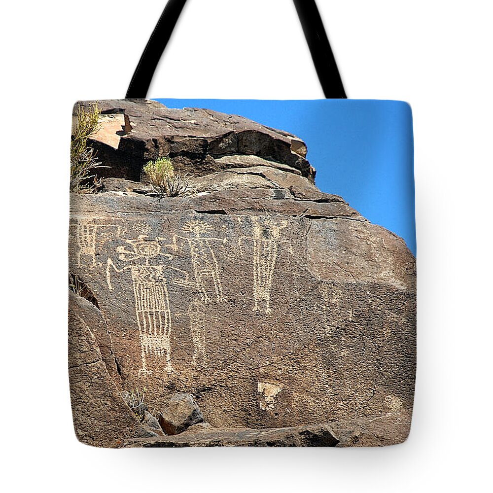 Petroglyph Tote Bag featuring the photograph Shaman Group Petroglyph by John Bennett