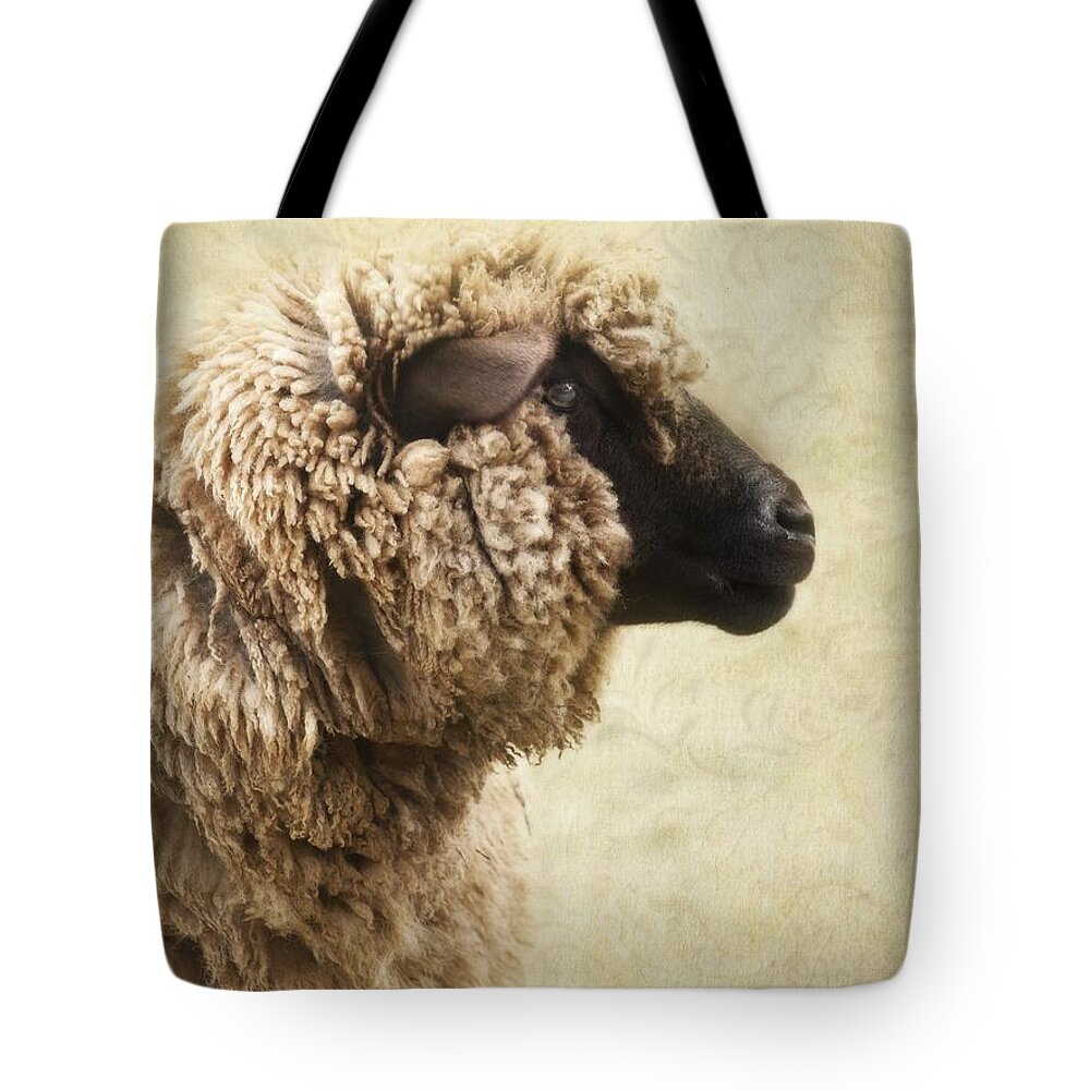 Sheep Tote Bag featuring the photograph Side Face Of A Sheep by Priska Wettstein