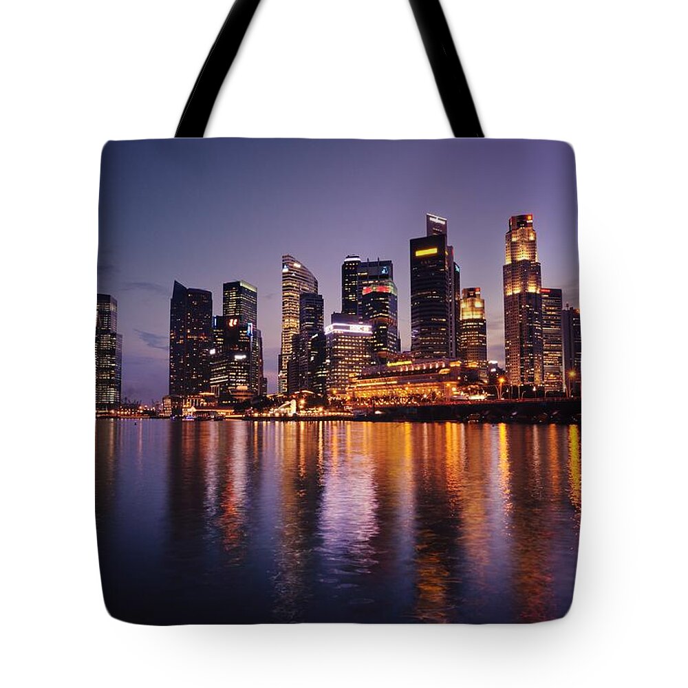 Financial District Tote Bag featuring the photograph Singapore Skyline With Purple Sky by Carlina Teteris