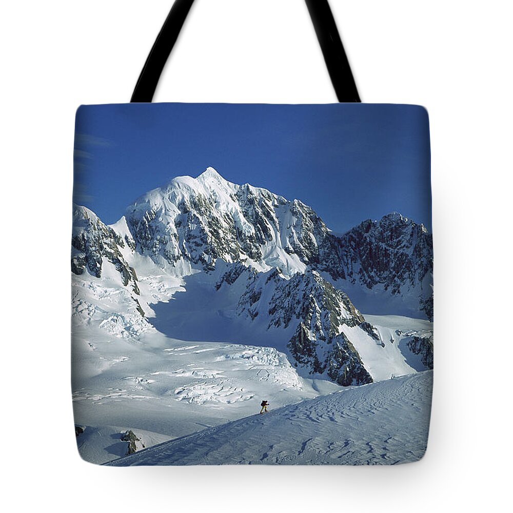 Feb0514 Tote Bag featuring the photograph Ski Mountaineer And Mt Tasman by Colin Monteath