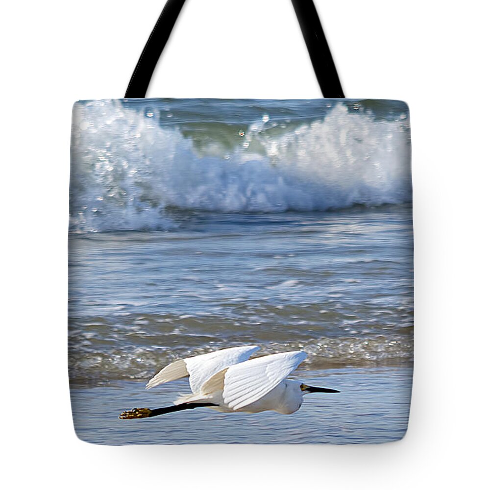 Wildlife Tote Bag featuring the photograph Snowy Egret and Waves by Kenneth Albin