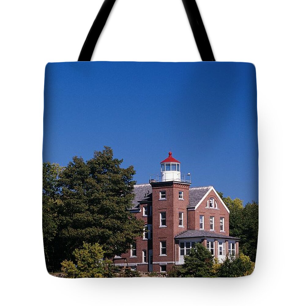 Light House Tote Bag featuring the photograph South Bass Island Lighthouse on Lake erie by John Harmon