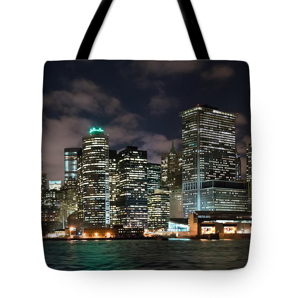 View Of South Ferry Manhattan New York City At Night From The Water Tote Bag featuring the photograph South Ferry Manhattan at Night by Kenneth Cole