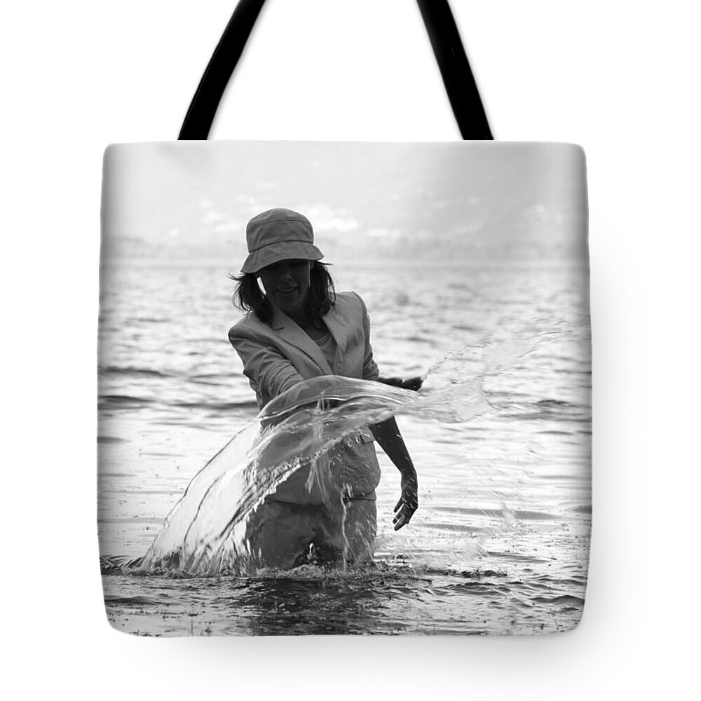 Woman Tote Bag featuring the photograph Splashing by Mats Silvan