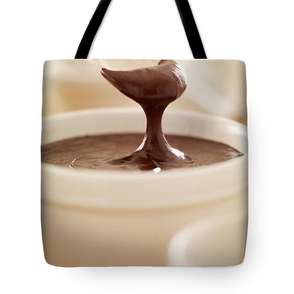 Melting Tote Bag featuring the photograph Spoon Scooping Melted Chocolate From by Adam Gault