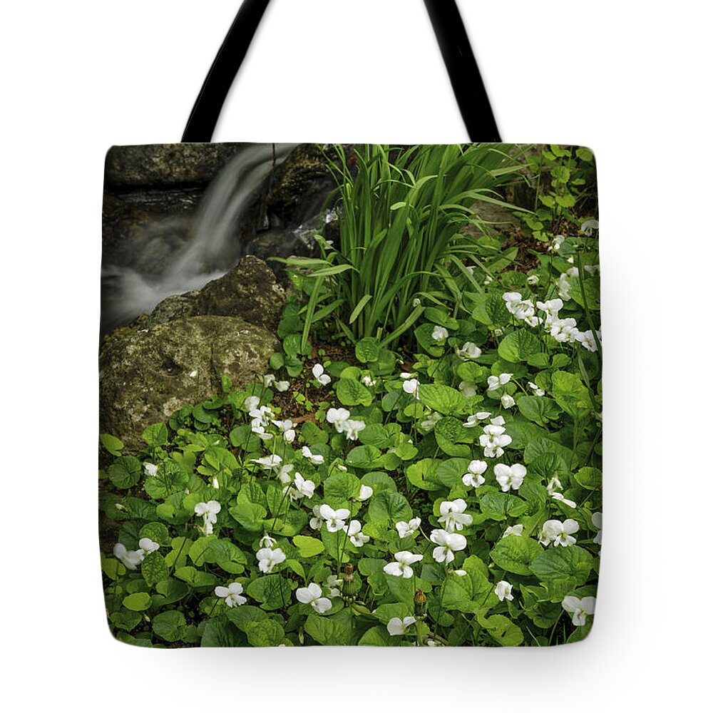 Spring Tote Bag featuring the photograph Spring flowers near creek by Elena Elisseeva