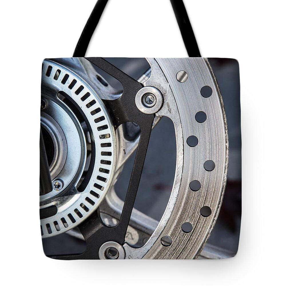 Steel Tote Bag featuring the photograph Steel wheel abstract by Eti Reid