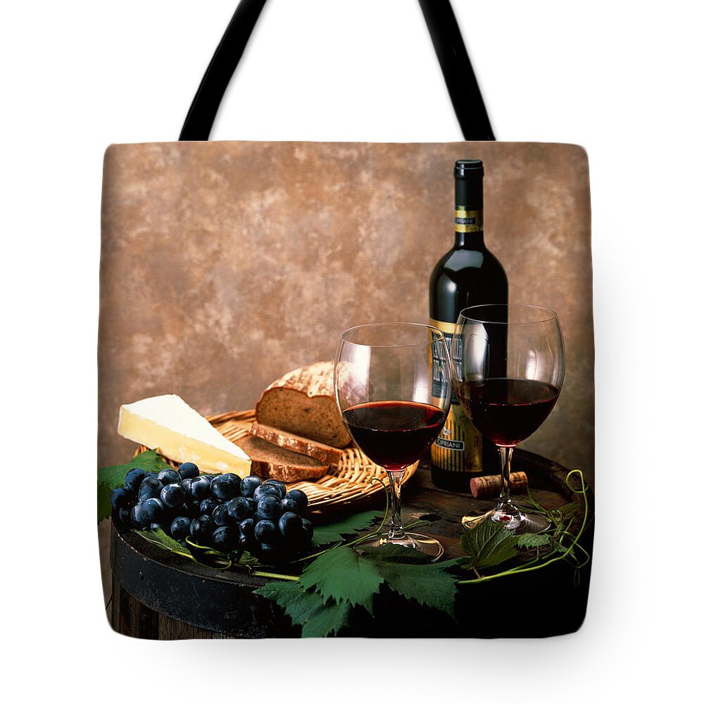 Photography Tote Bag featuring the photograph Still Life Of Wine Bottle, Wine by Panoramic Images