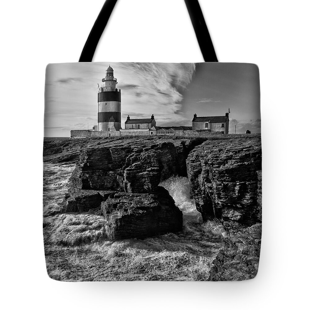 Hook Tote Bag featuring the photograph Stormy day at Hook Head Lighthouse by Nigel R Bell