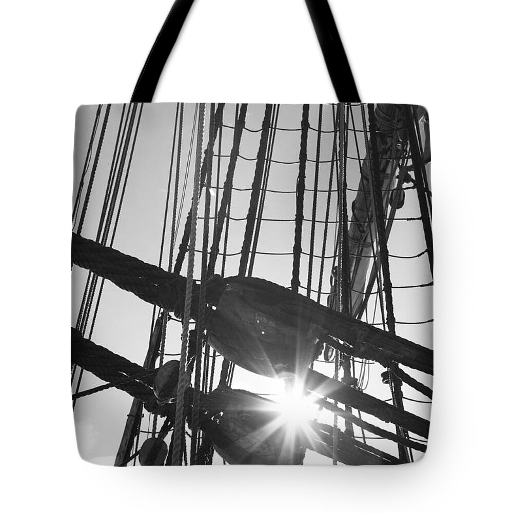 18th Century Tote Bag featuring the photograph Sun shining though the rigging - monochrome by Ulrich Kunst And Bettina Scheidulin