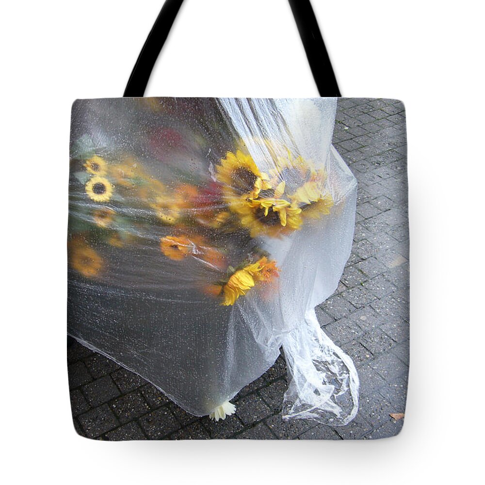 Sunflowers Tote Bag featuring the photograph Sunflowers protected against rain by Matthias Hauser