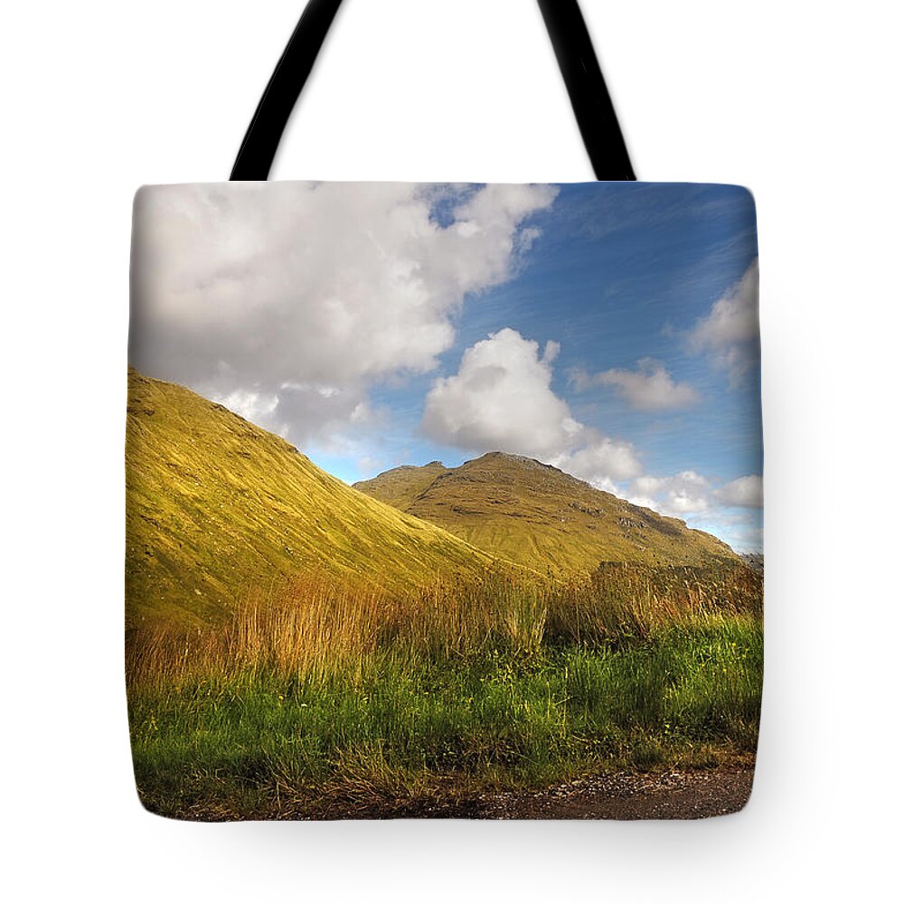 Scotland; Mountains; Rest And Be Thankful; Nature; Landscape; Bright Light; Light; Sun; Sunny; Warm Weather; Sky; Clouds; Scenery; Forest; Trees; Tranquility; Grass; Autumn; Summer; Beauty; Beautiful Nature; Fine Weather; Colorful; Colors; Shadow; Fine Art; Fine Art Photography; Artistic; Blesses Tote Bag featuring the photograph Sunny Day at Rest and Be Thankful. Scotland by Jenny Rainbow