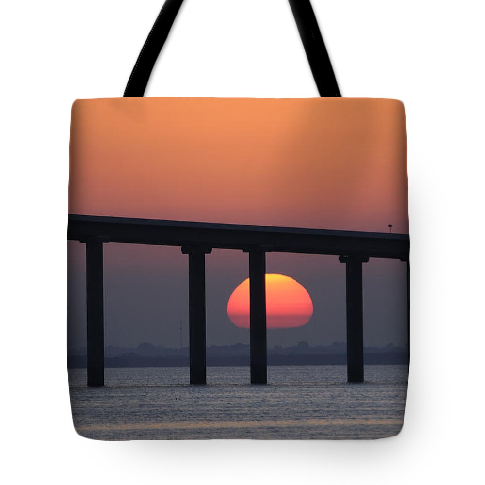 Sunshine Skyway Bridge Tote Bag featuring the photograph Sunrise and bridge by Bradford Martin