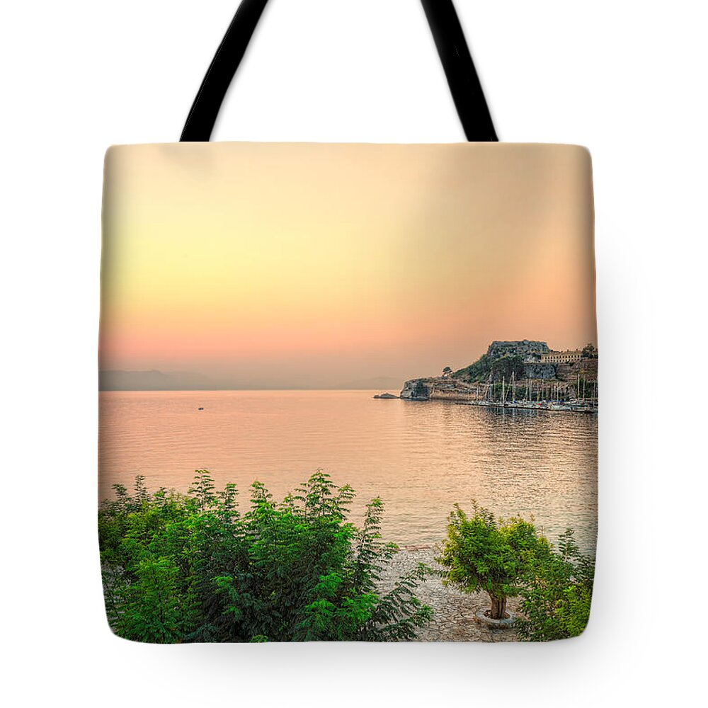 Sunrise Tote Bag featuring the photograph Sunrise at the old fortress of Corfu - Greece by Constantinos Iliopoulos