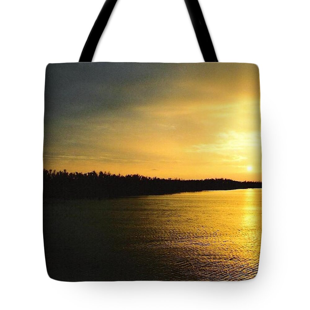 Sunrise Tote Bag featuring the photograph Sunrise On Ole Man River by Michael Hoard