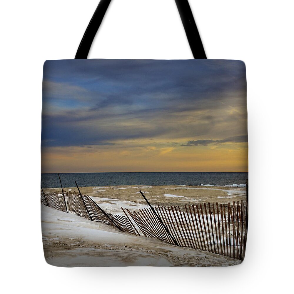 Michigan Tote Bag featuring the photograph Sunset by the Beach at Grand Haven Michigan during Winter by Randall Nyhof