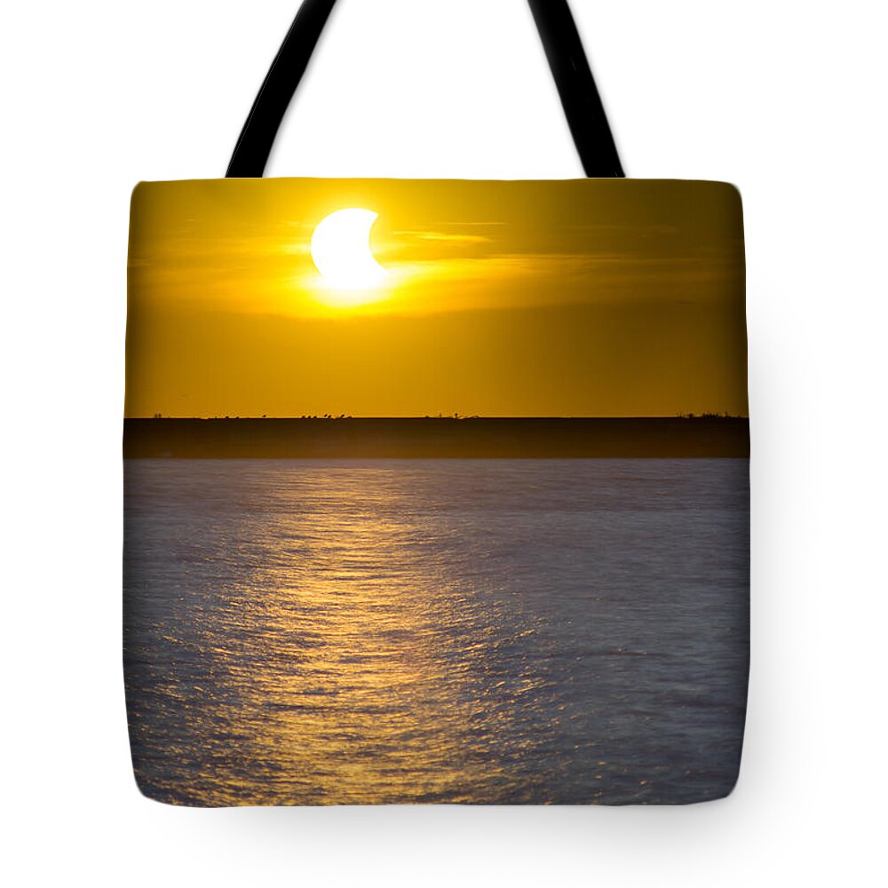 Solar Eclipse Tote Bag featuring the photograph Sunset Eclipse by Chris Bordeleau