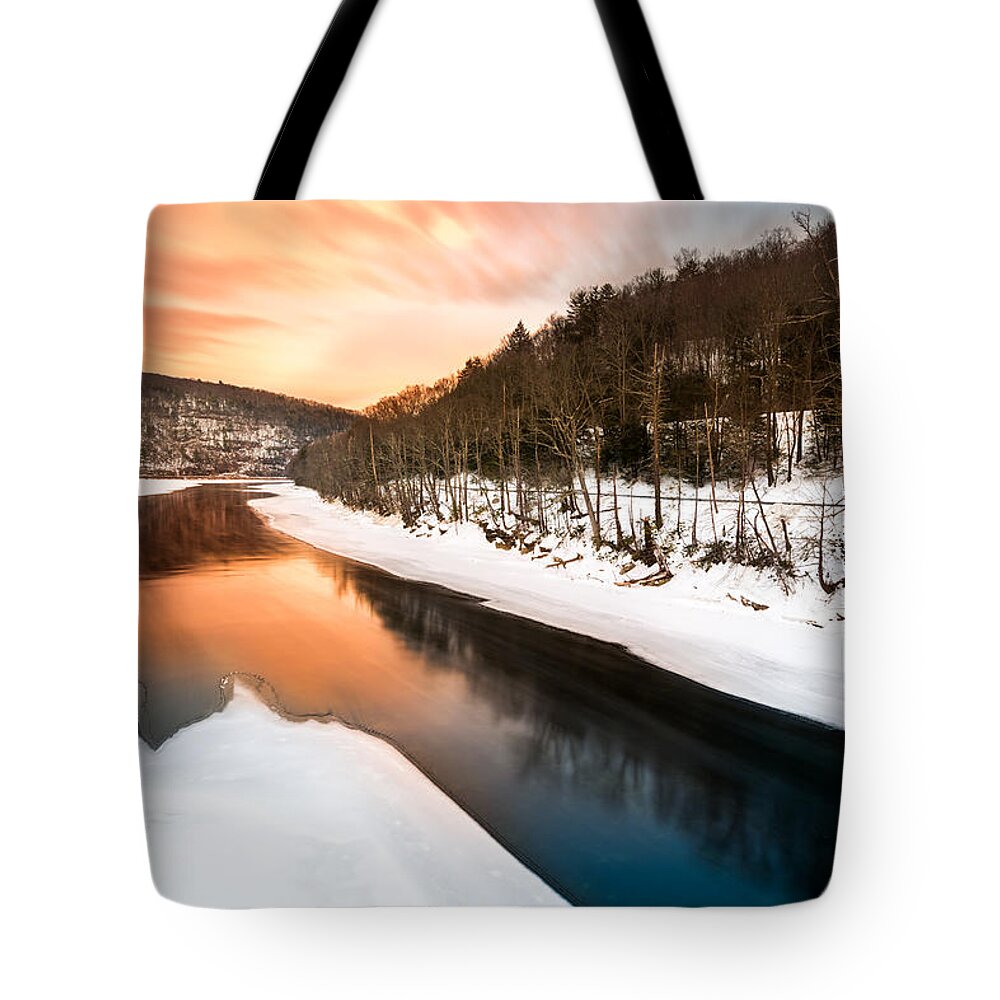 Pond Eddy Tote Bag featuring the photograph Sunset over a frozen Delaware river by Mihai Andritoiu