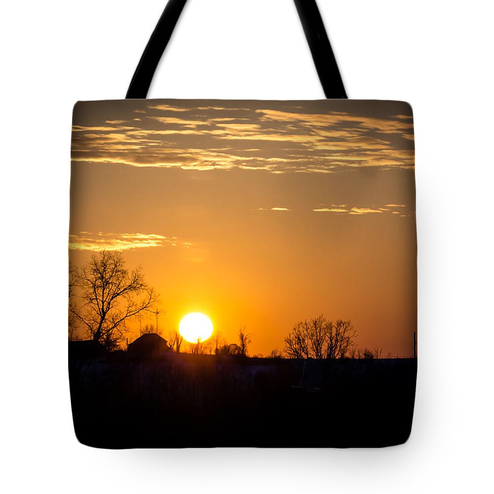 Sunset Tote Bag featuring the photograph Sunset Over the Distant Farm by Holden The Moment