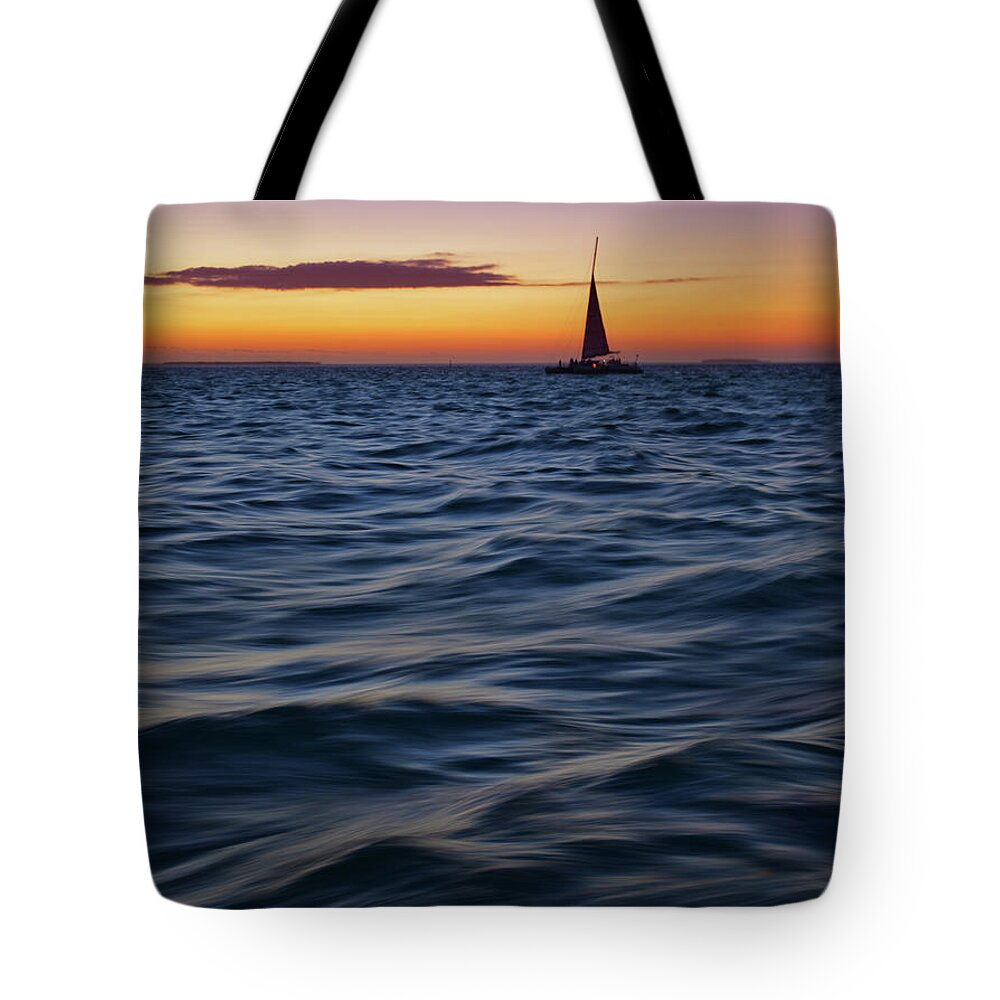 Scenics Tote Bag featuring the photograph Sunset Sail by Photography By Susan Hall Frazier